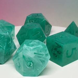 Tidecaller Emeralds handmade resin RPG dice set by Roll 4 Shenanigans with rich emerald tones and ocean-inspired style