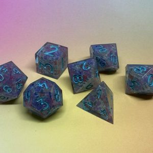 Feywild Blossom Dice handmade floral resin RPG dice set by Roll 4 Shenanigans with teal numbers and translucent wildflower-inspired design